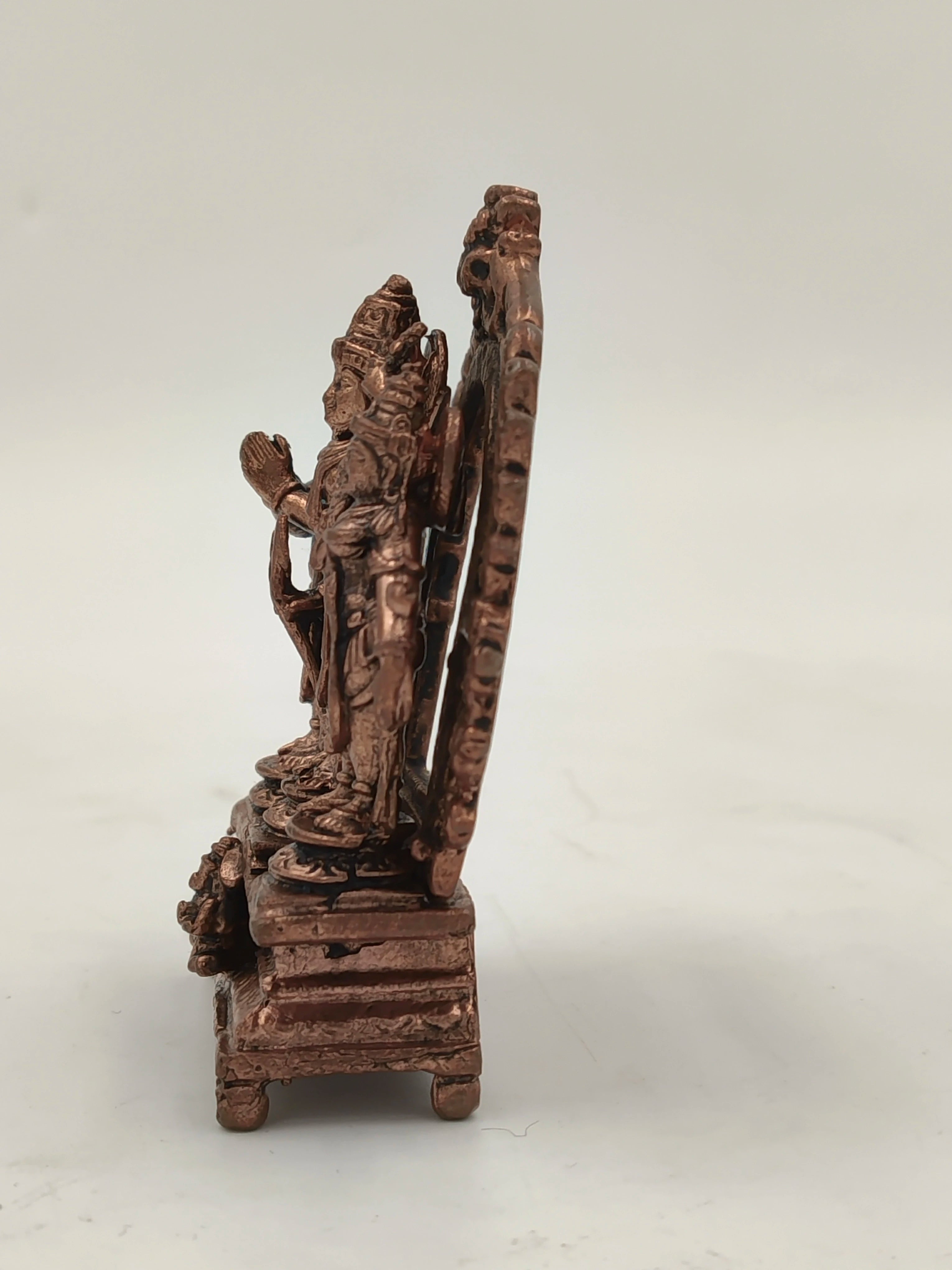 Side view of small copper Ram parivar brass sculpture on a pedestal