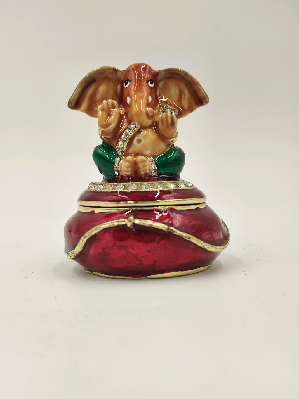 Mini brass enamel box with Ganesh statue and red and green detailing