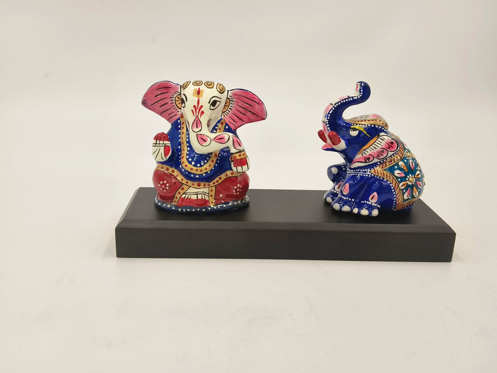 Hand-painted Ganesha and elephant figurines on black rectangular base
