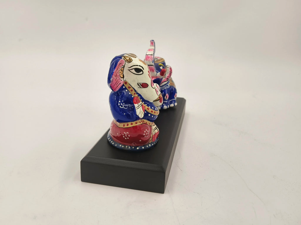 Colorful hand-painted Ganesh and elephant brass figurines on black base