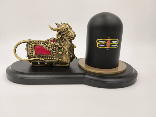 Brass Nandhi figurine with red accents and black Shivling on black base