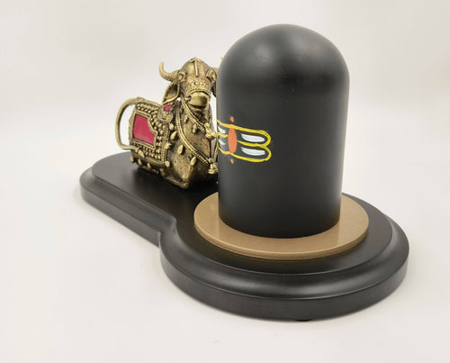 Brass Nandhi figurine with black Shivling on oval black base, side view