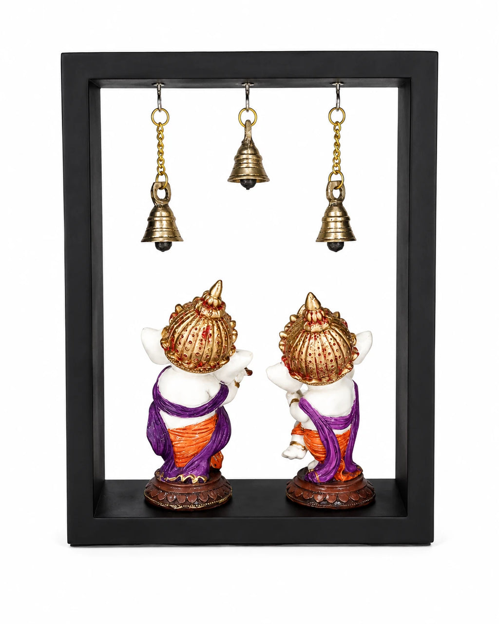 Large brass Ganesha figurines in a black frame with hanging brass bells side view