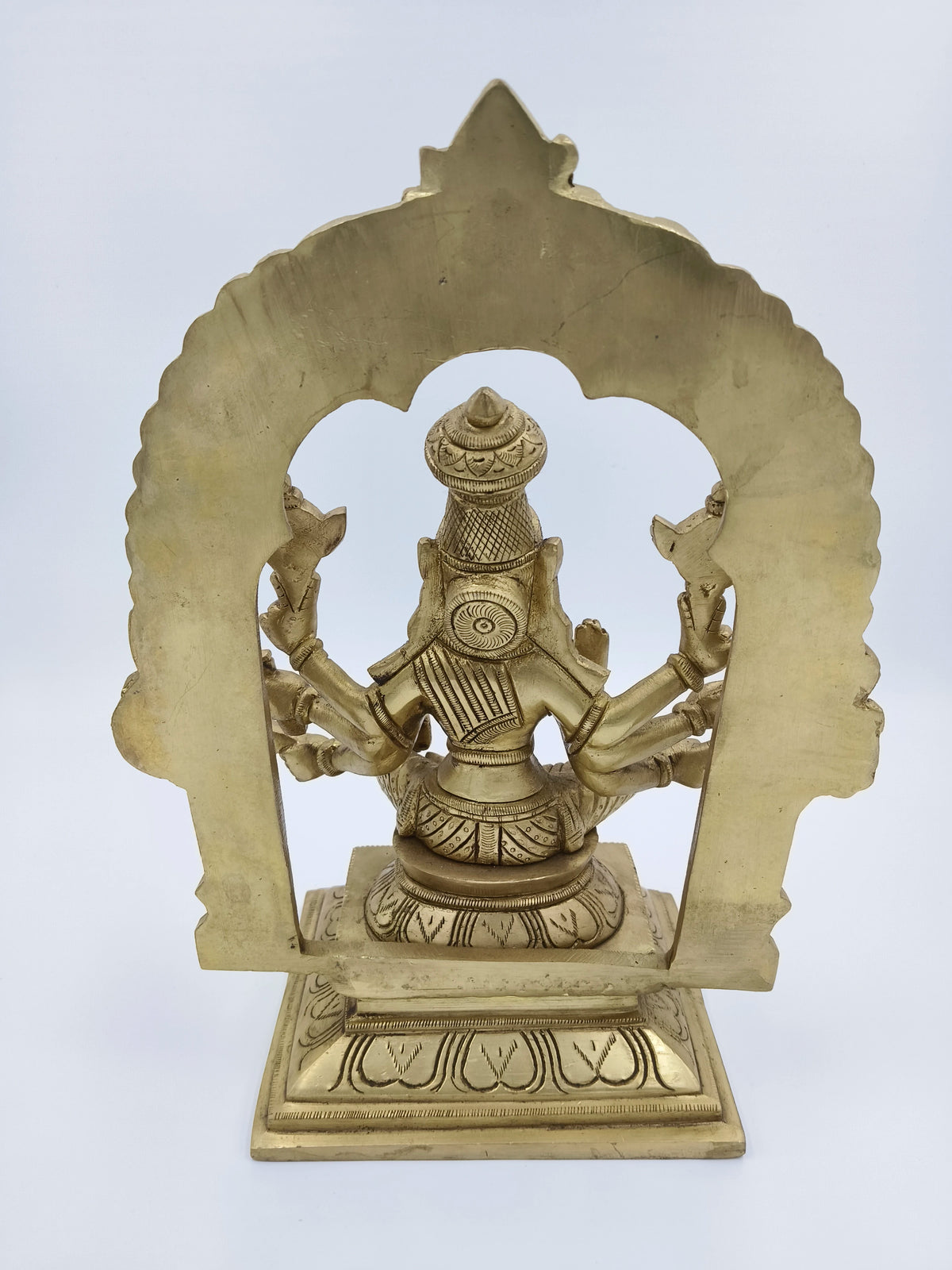 Rear view of large brass arch statue of Goddess Varahi with intricate detailing