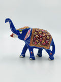 Small blue enamel elephant figurine with decorative floral patterns