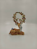 Medium-sized brass enamel deer figurine with decorated antlers and butterflies