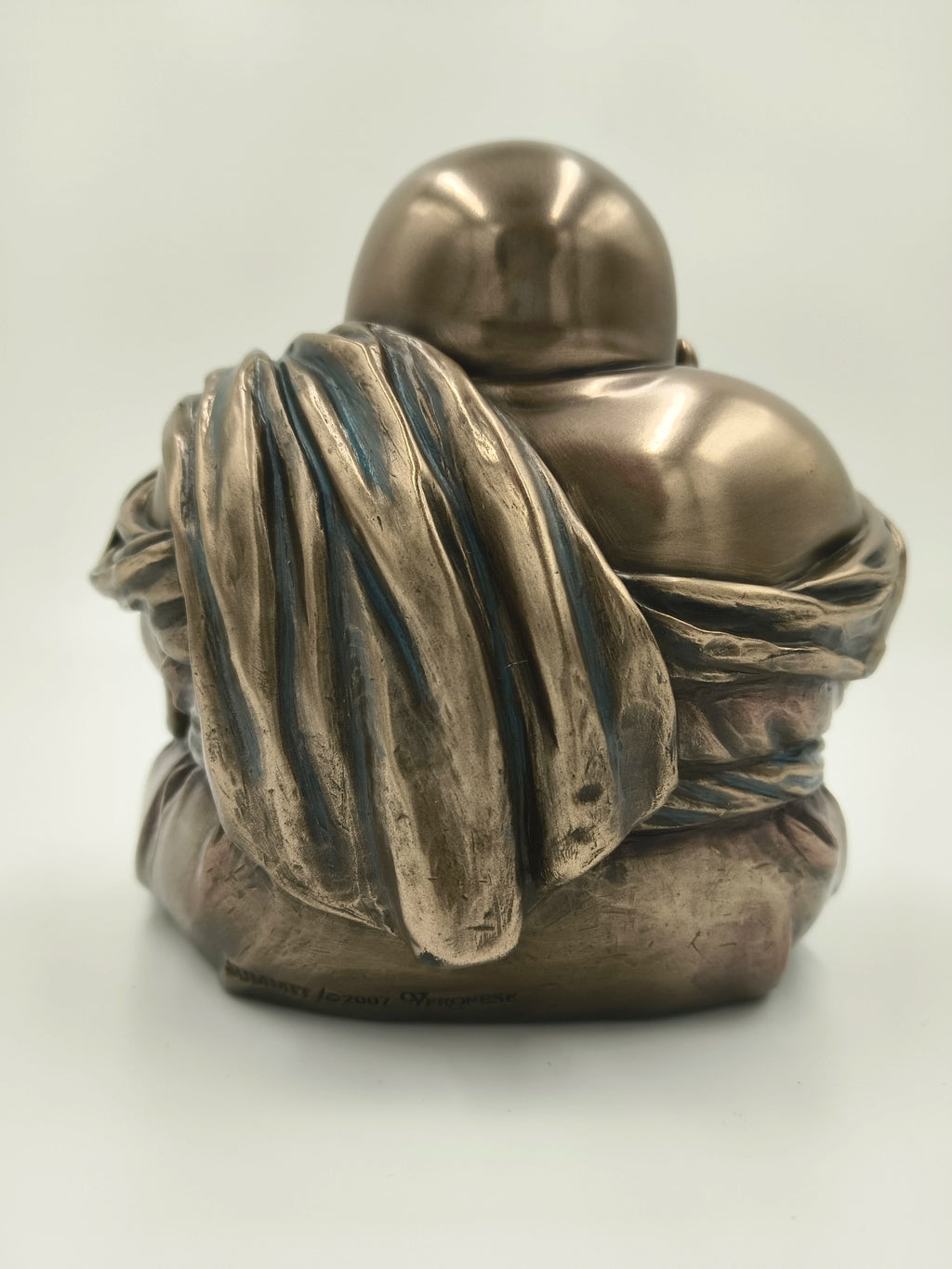 Back view of medium polyresin Laughing Buddha sculpture with draped robe