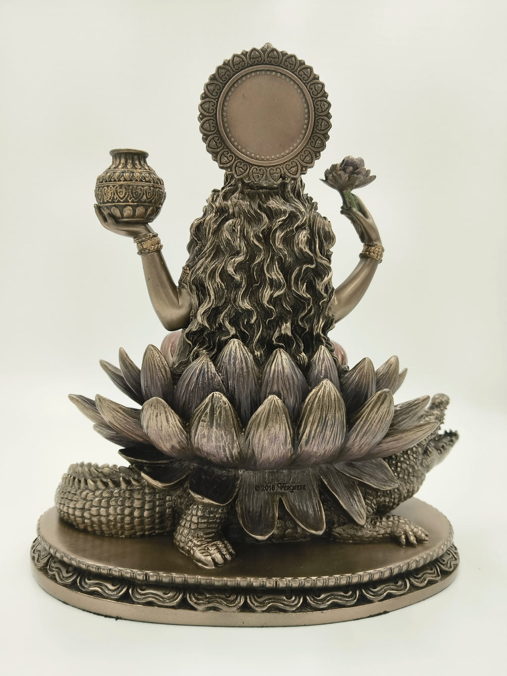 Back view of large polyresin Ganga Devi statue seated on a lotus with crocodile base