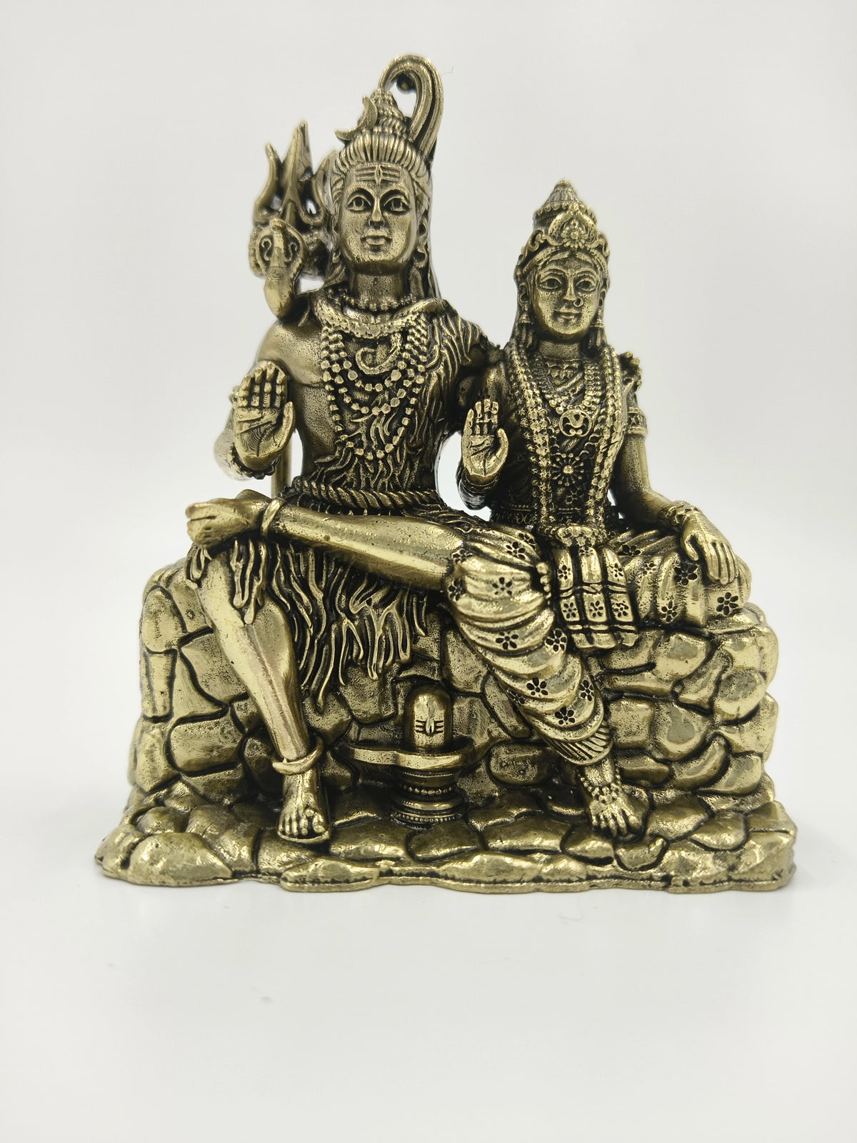 Small brass sculpture of Shiva and Parvati seated on a rock base