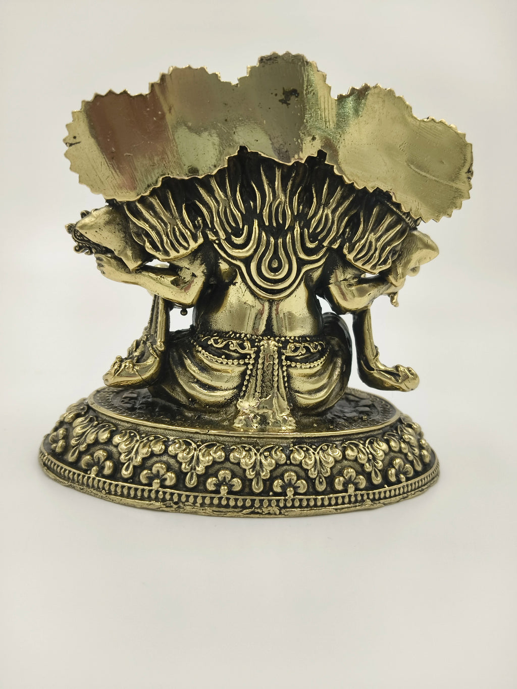 Rear view of small brass Panchamukhi Ganesha sculpture with intricate base