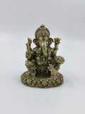 Small brass statue of sitting Ganesh with intricate floral base