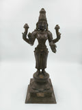 Bronze sculpture of Dhanvantari deity standing on a decorated square base