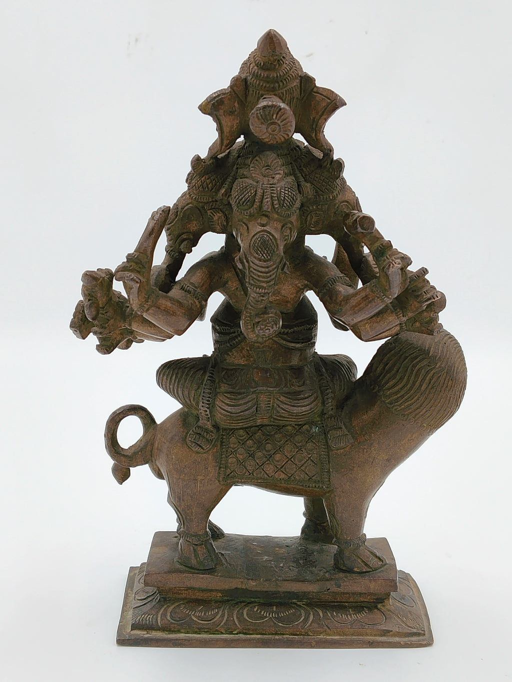 Bronze statue of five-faced Ganesh seated on a lion with detailed carvings