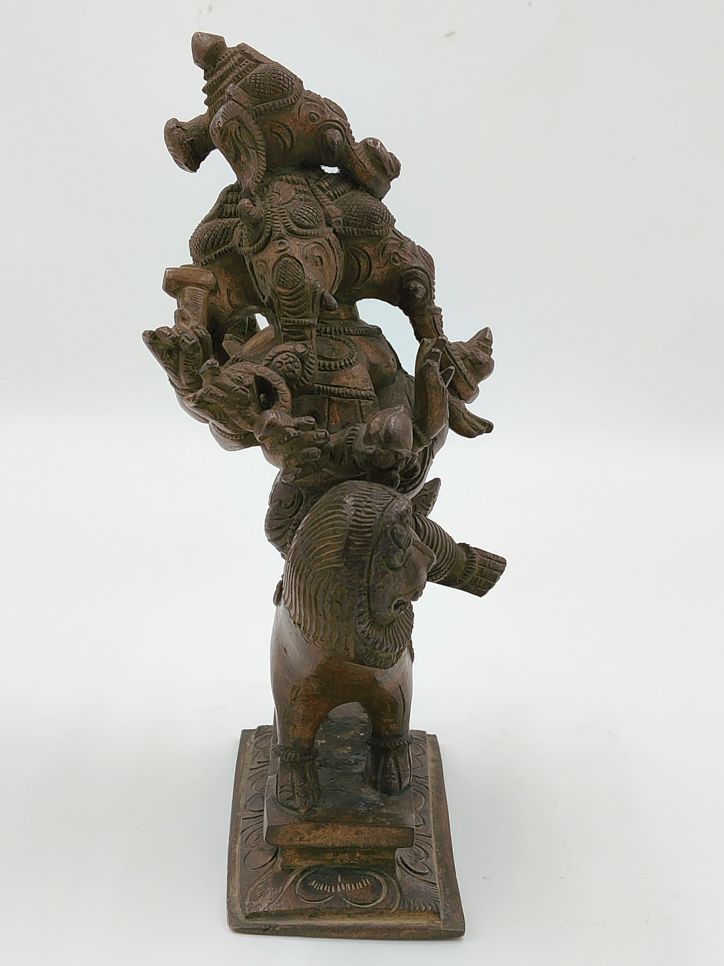 Bronze Ganesh statue with five faces standing on a lion base