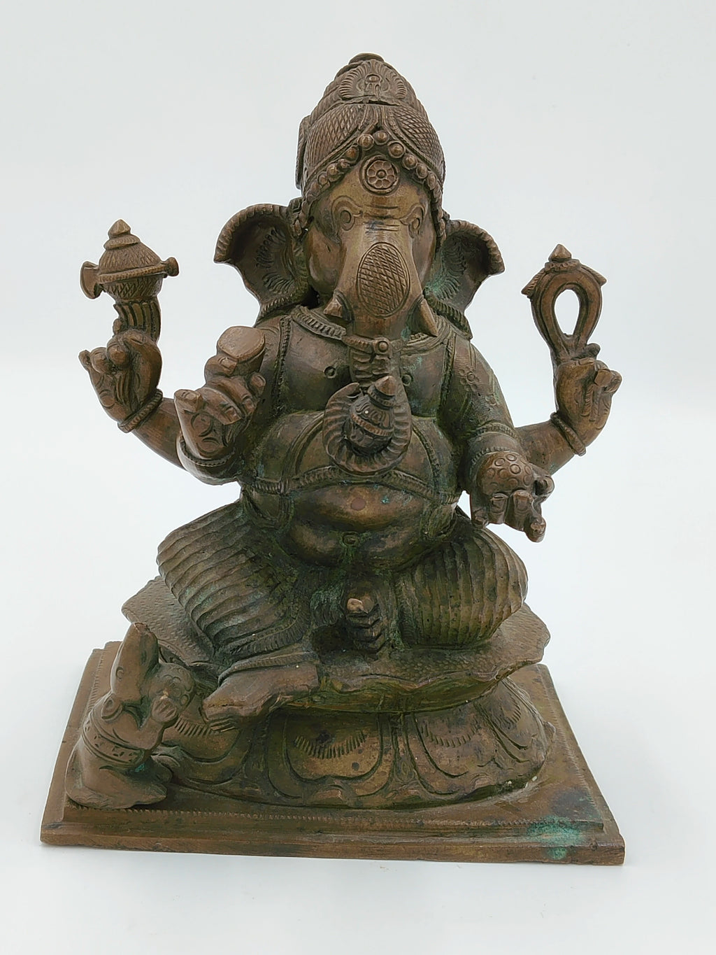 Large bronze statue of Ganesh deity seated on a decorated base with four arms