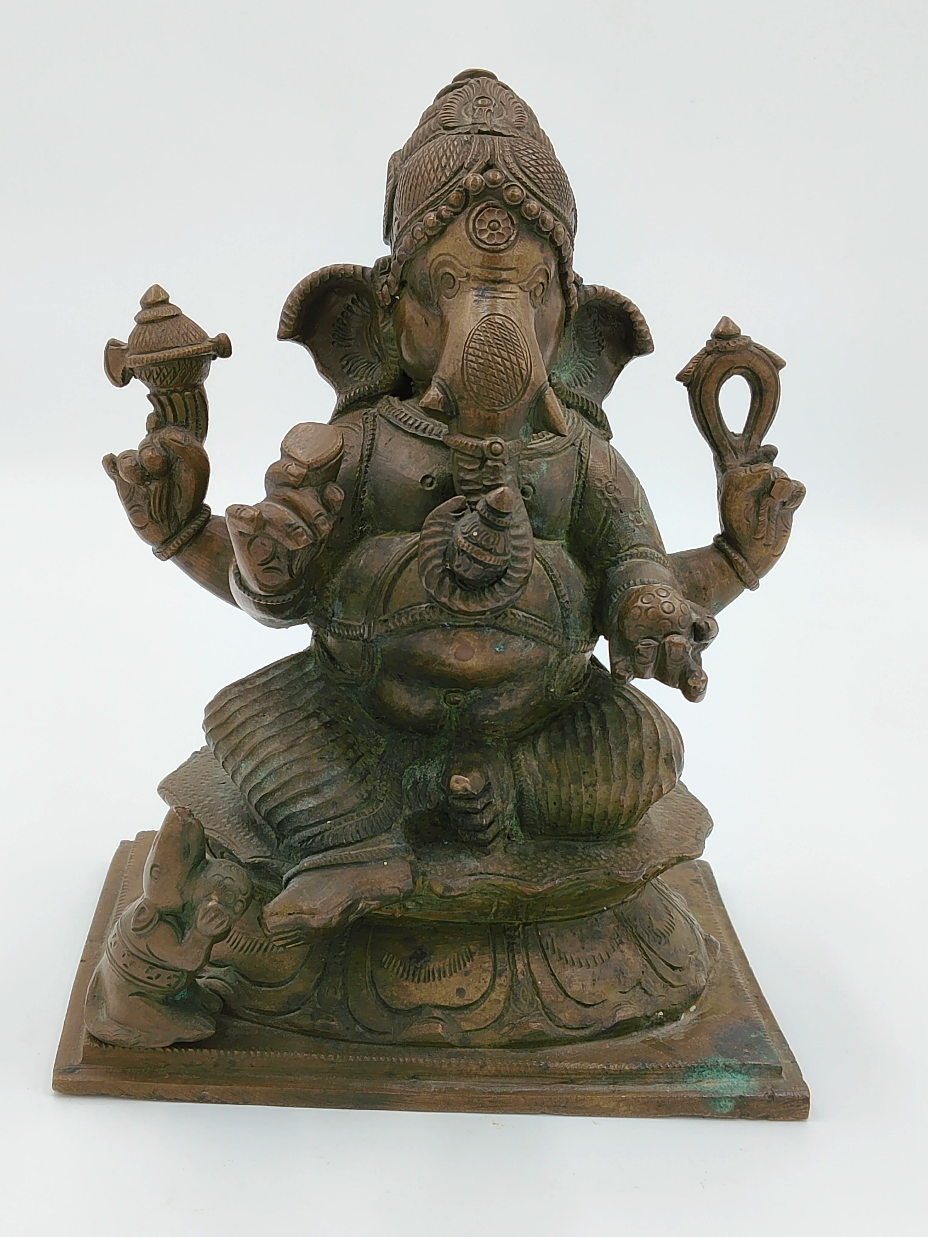 Large bronze statue of Ganesh deity seated on a decorated base with four arms