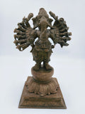 Front view bronze Ganesh statue with multiple arms on decorative pedestal