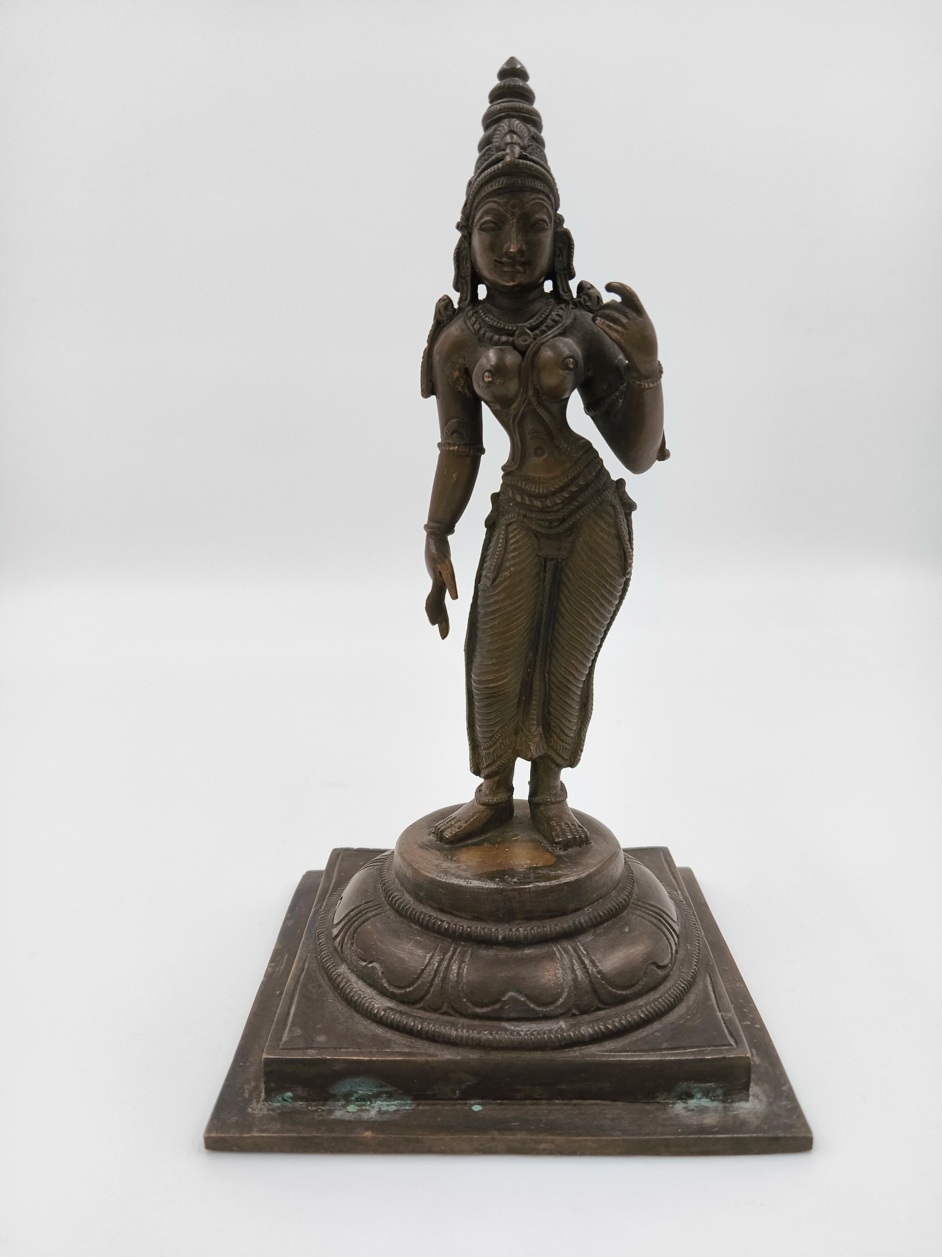 Bronze sculpture of Parvathi deity standing on decorated square base, front view