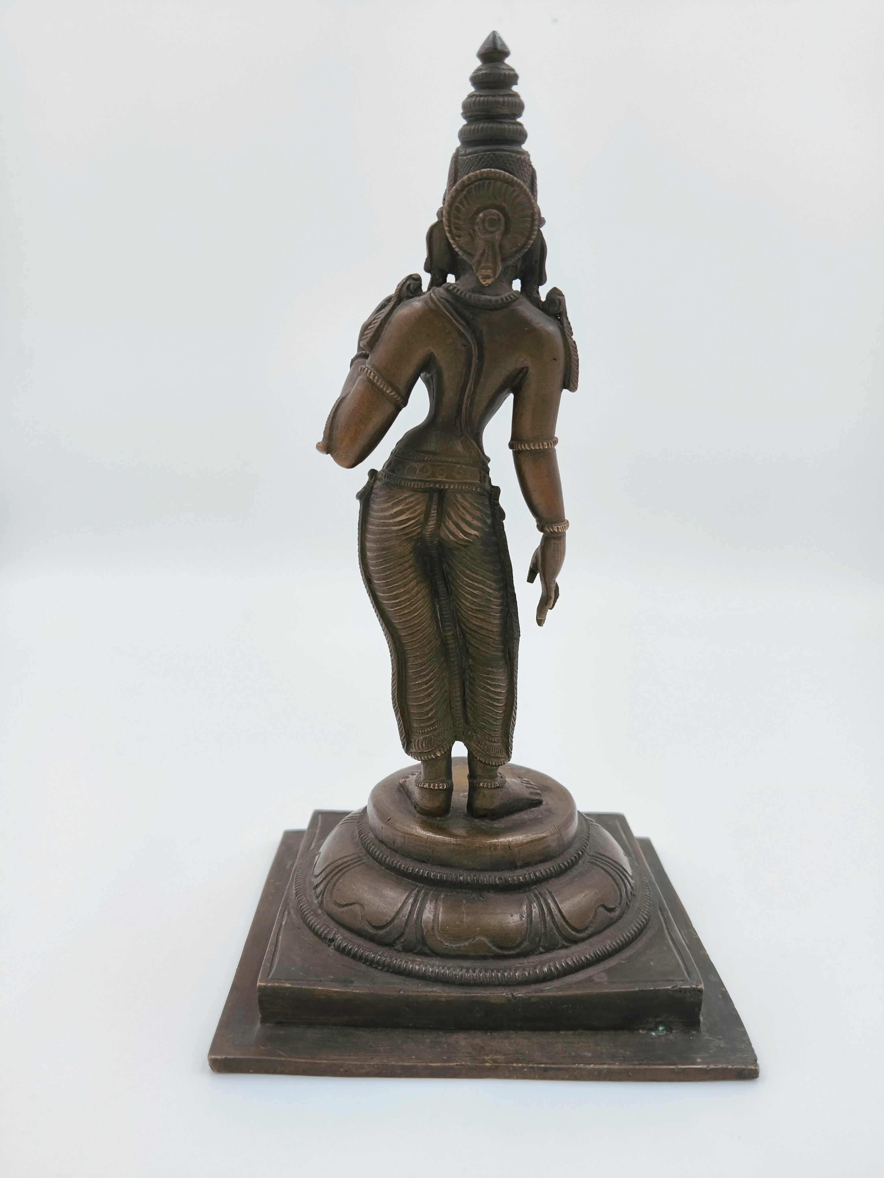 Back view of bronze Parvathi statue on square base with detailed carvings