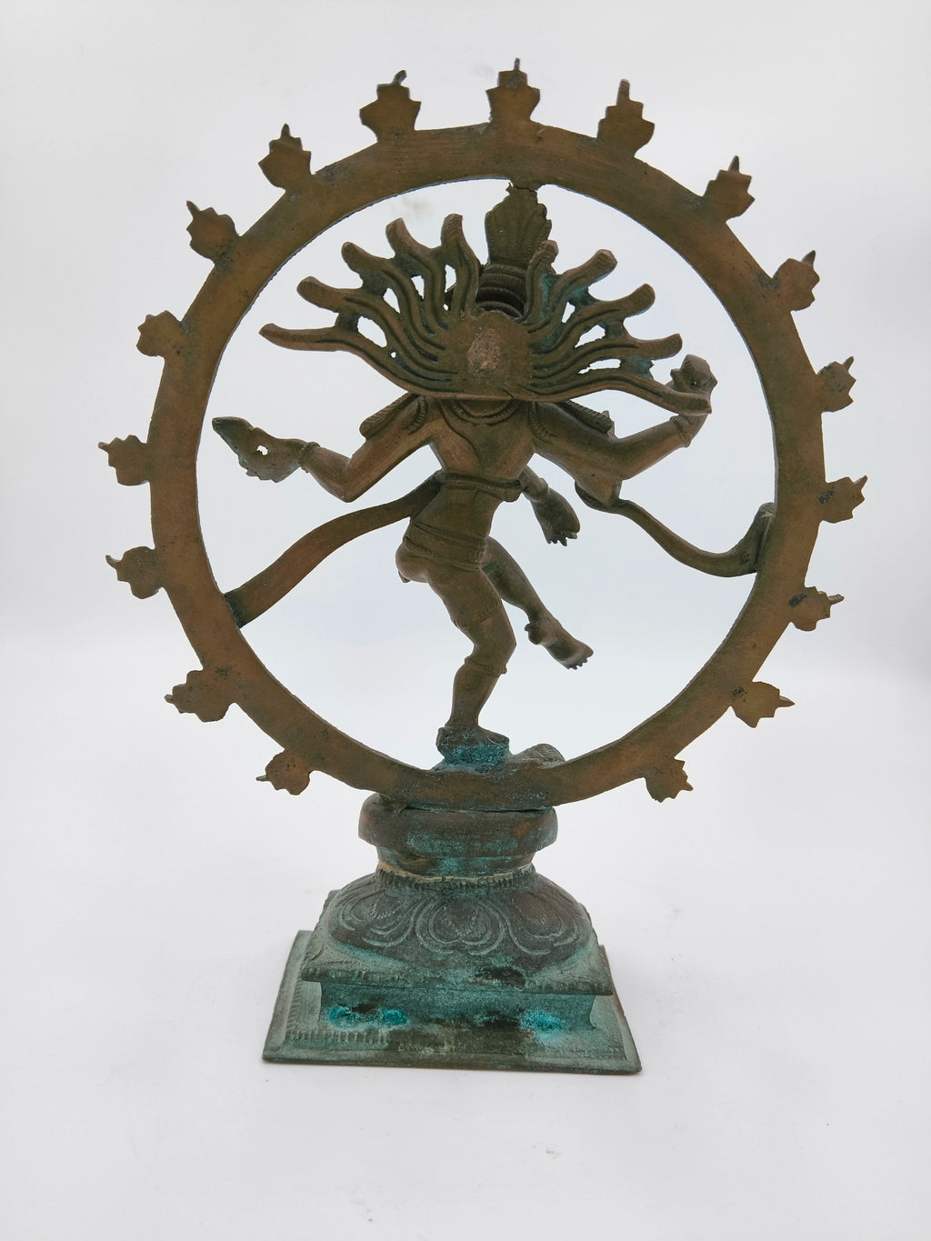 Bronze Nataraja sculpture with circular frame on decorative base, front view