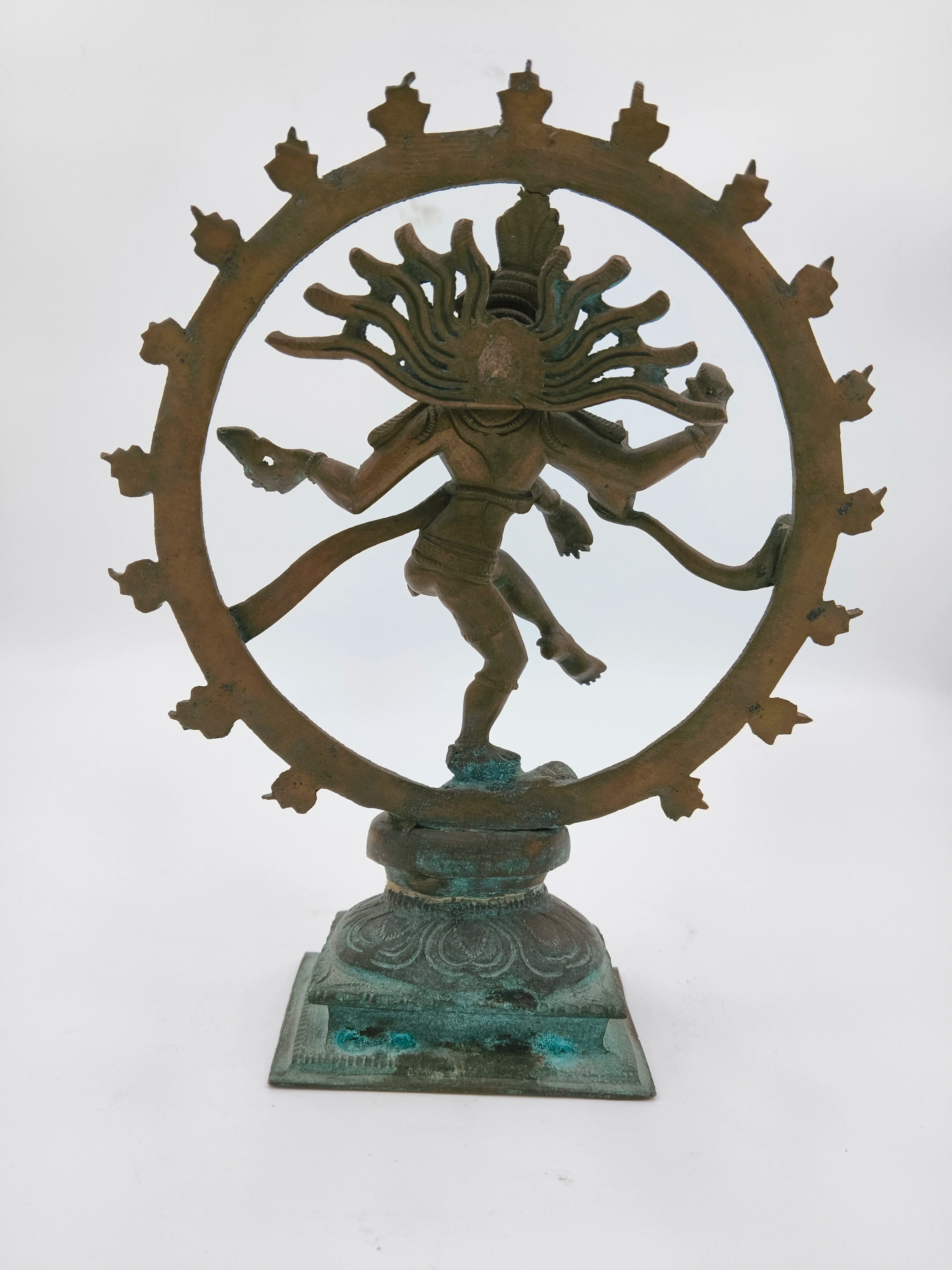 Bronze Nataraja sculpture with circular frame on decorative base, front view
