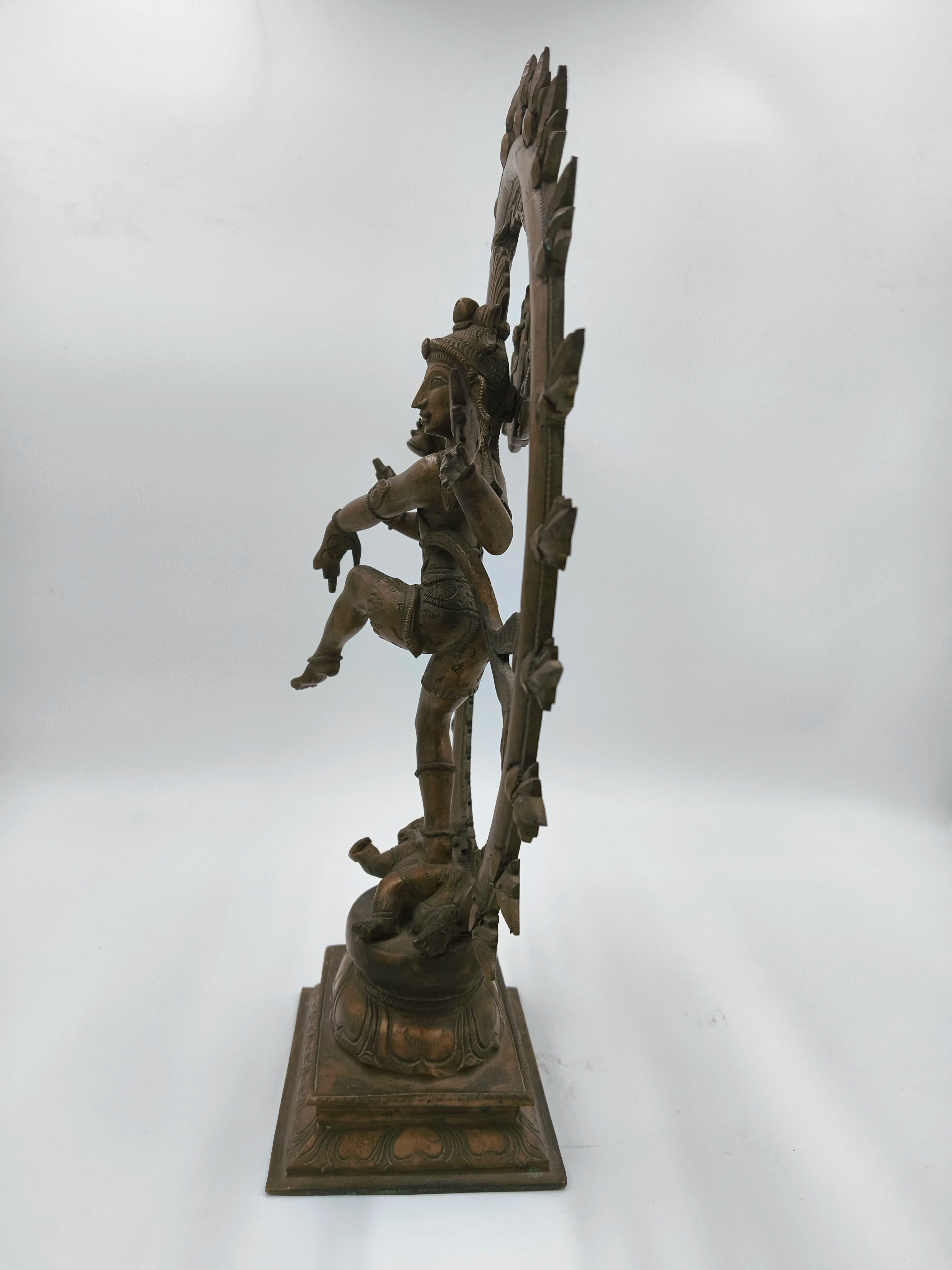 Side view of large bronze Nataraja statue depicting Lord Shiva's cosmic dance