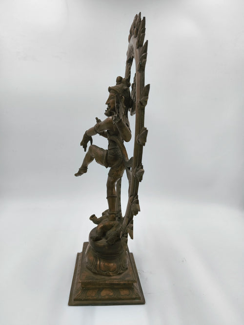 Side view of large bronze Nataraja statue depicting Lord Shiva's cosmic dance