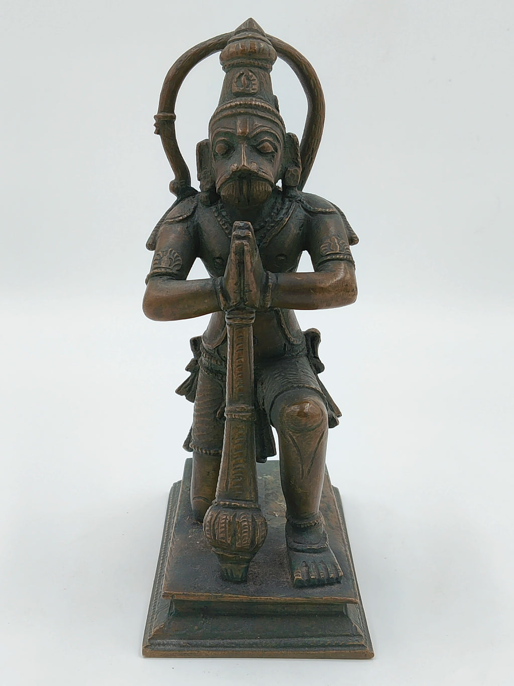 Front view of bronze Hanuman statue kneeling with folded hands on a rectangular base