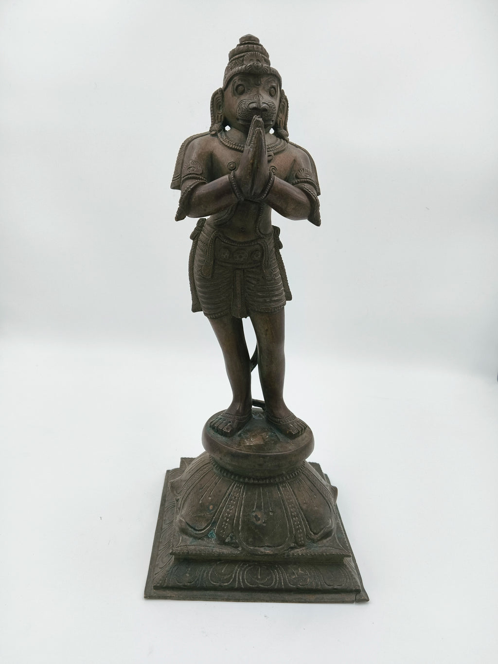 Bronze Hanuman sculpture standing with namaskaram pose on decorative base