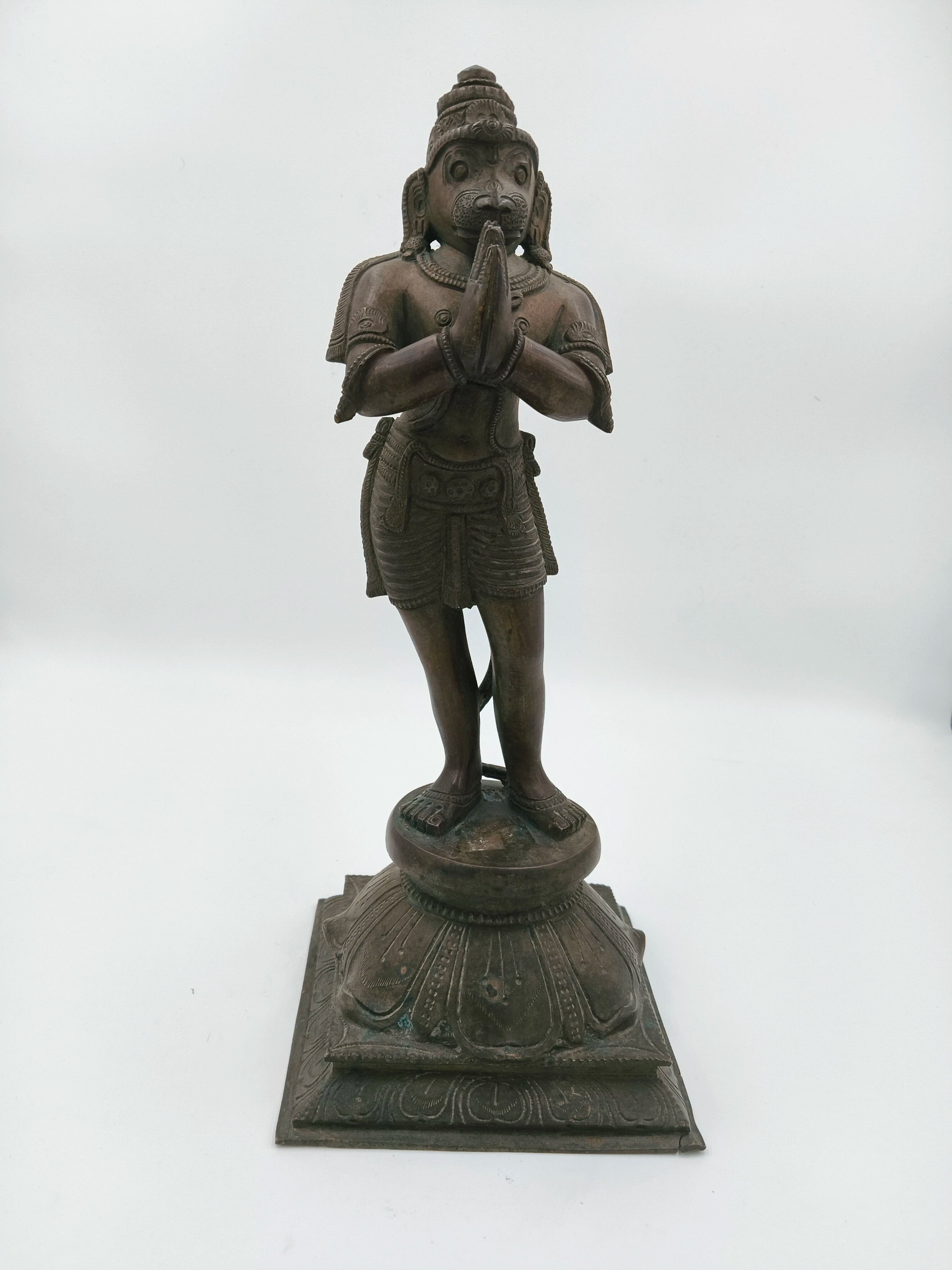 Bronze Hanuman sculpture standing with namaskaram pose on decorative base