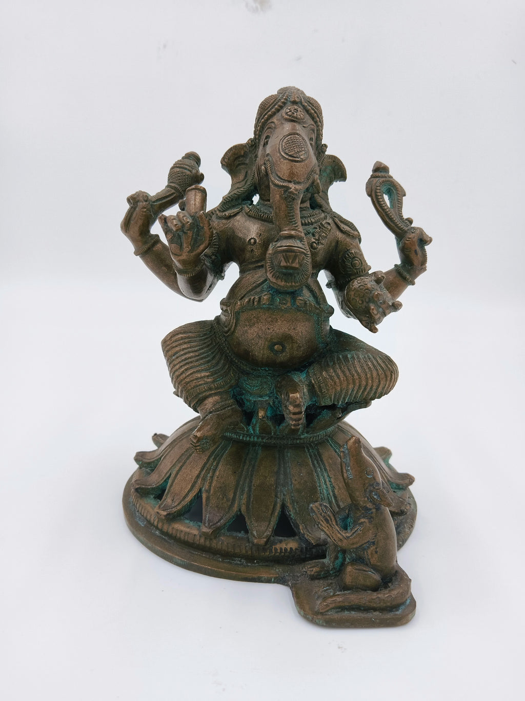 Bronze sculpture of Ganesh seated with a mouse on round pedestal