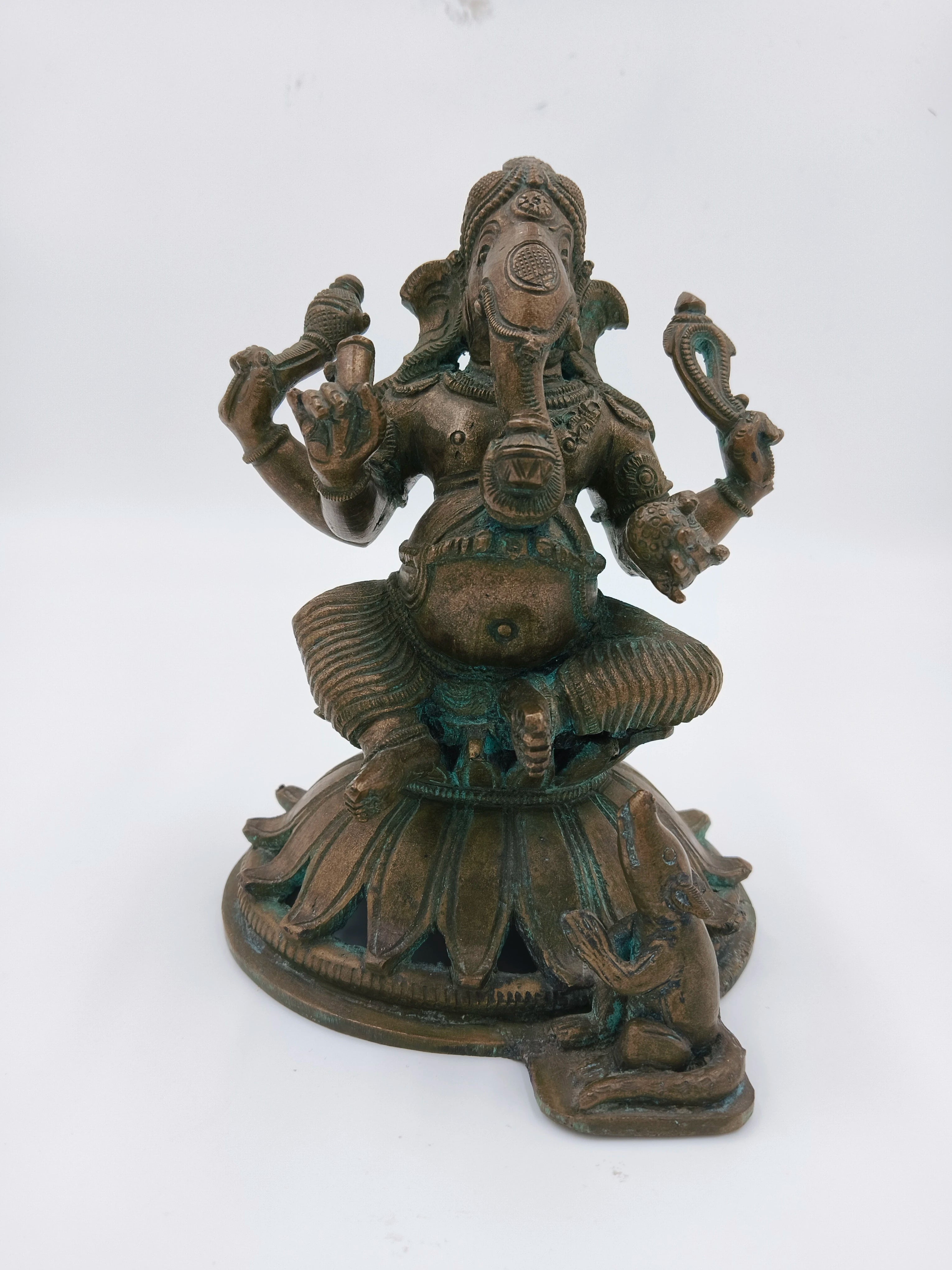 Bronze sculpture of Ganesh seated with a mouse on round pedestal