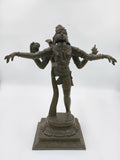 Bronze Nataraja statue with four arms in dancing pose on square pedestal