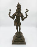 Bronze sculpture of Hindu deity Shiva standing on ornate pedestal