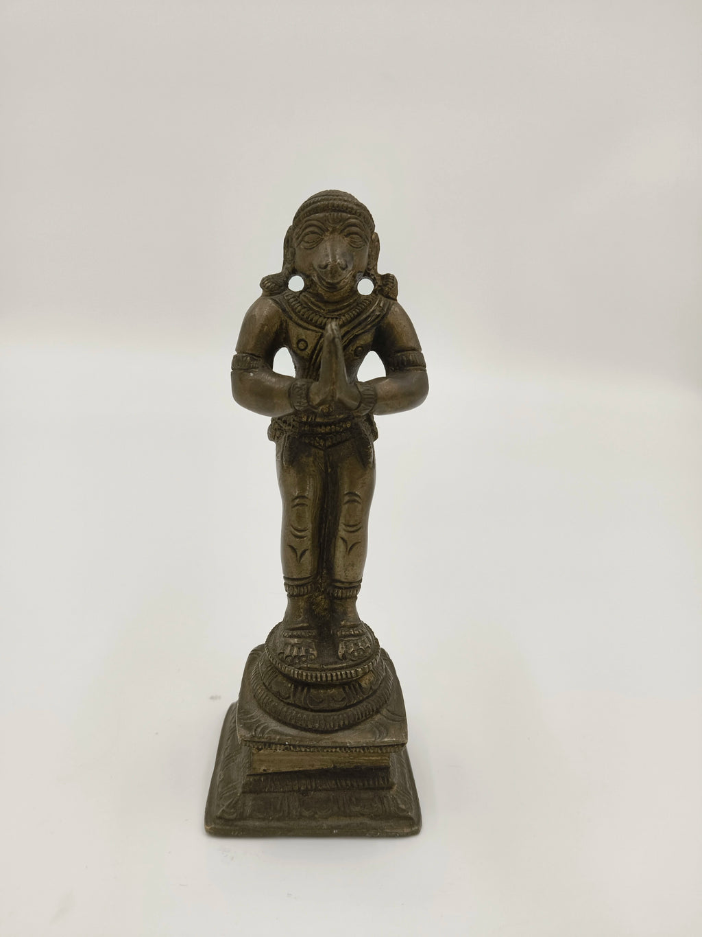 Bronze Hanuman sculpture standing with hands joined in prayer on square base