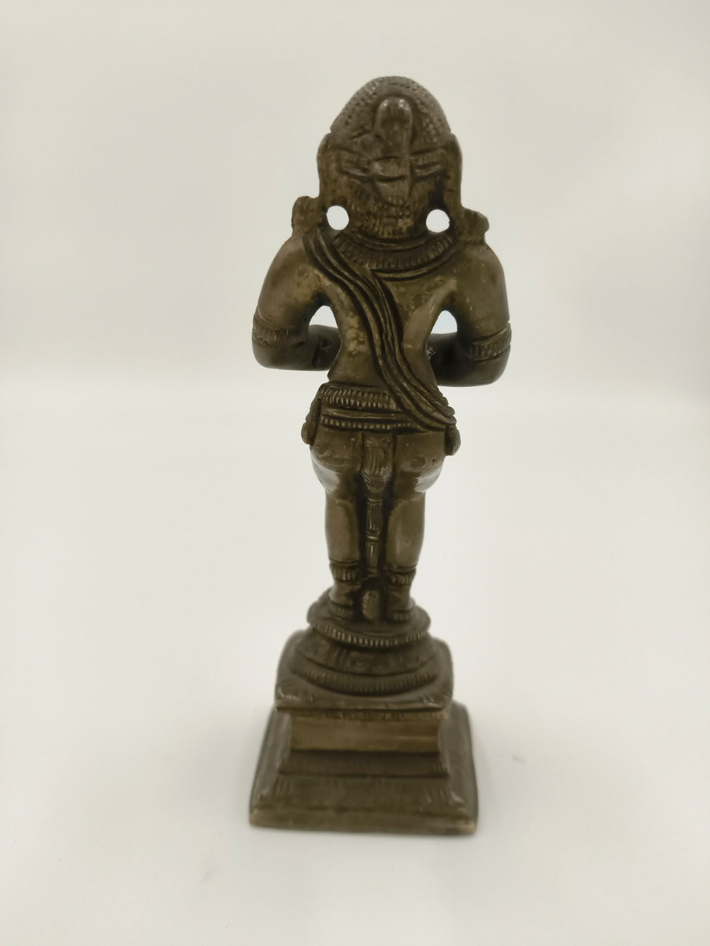 Rear view of a 4.5 inch bronze Hanuman sculpture on a pedestal