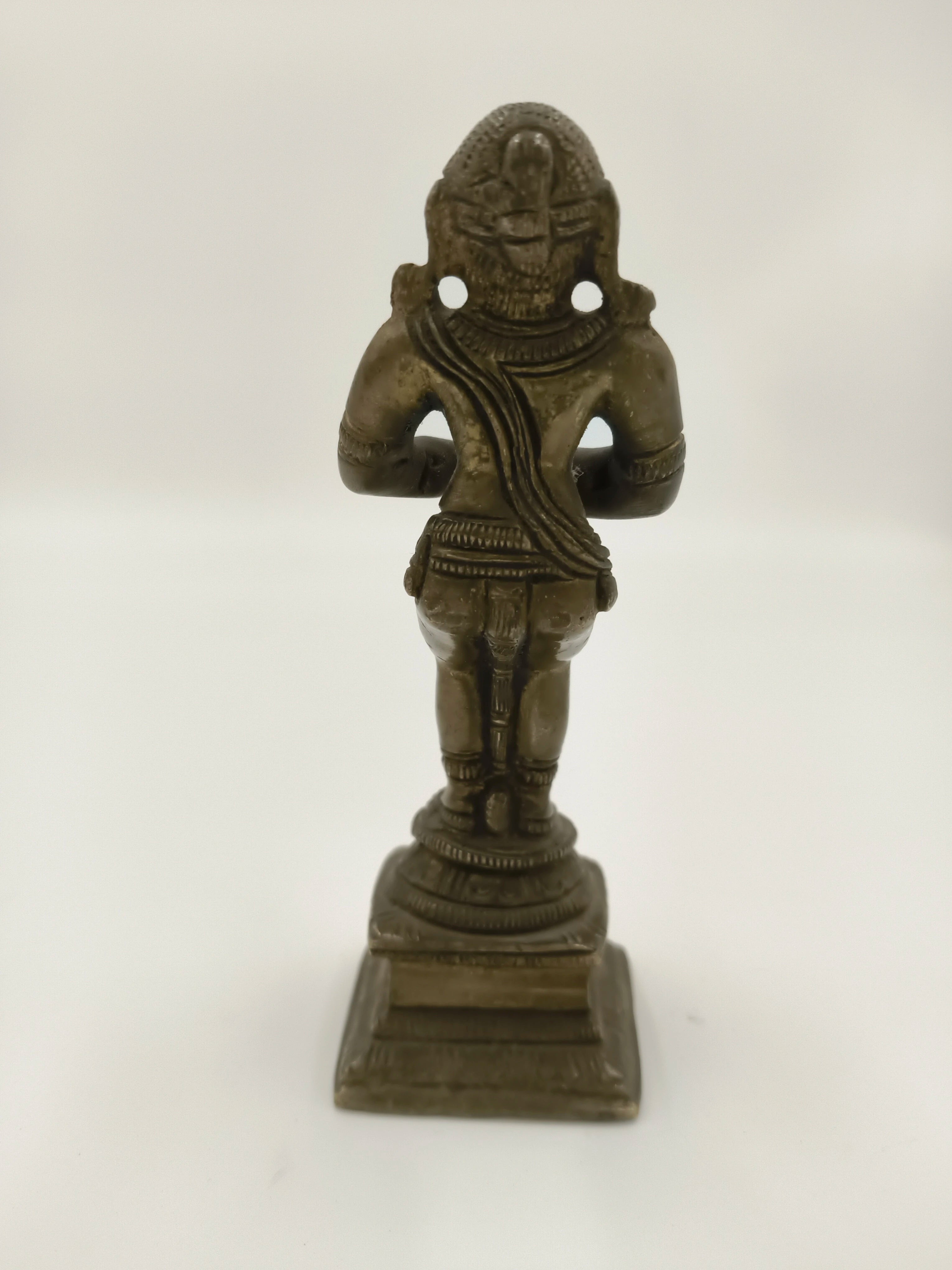 Rear view of a 4.5 inch bronze Hanuman sculpture on a pedestal