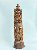 Tall sandalwood sculpture depicting Ganesh and Karthikaya on wooden base