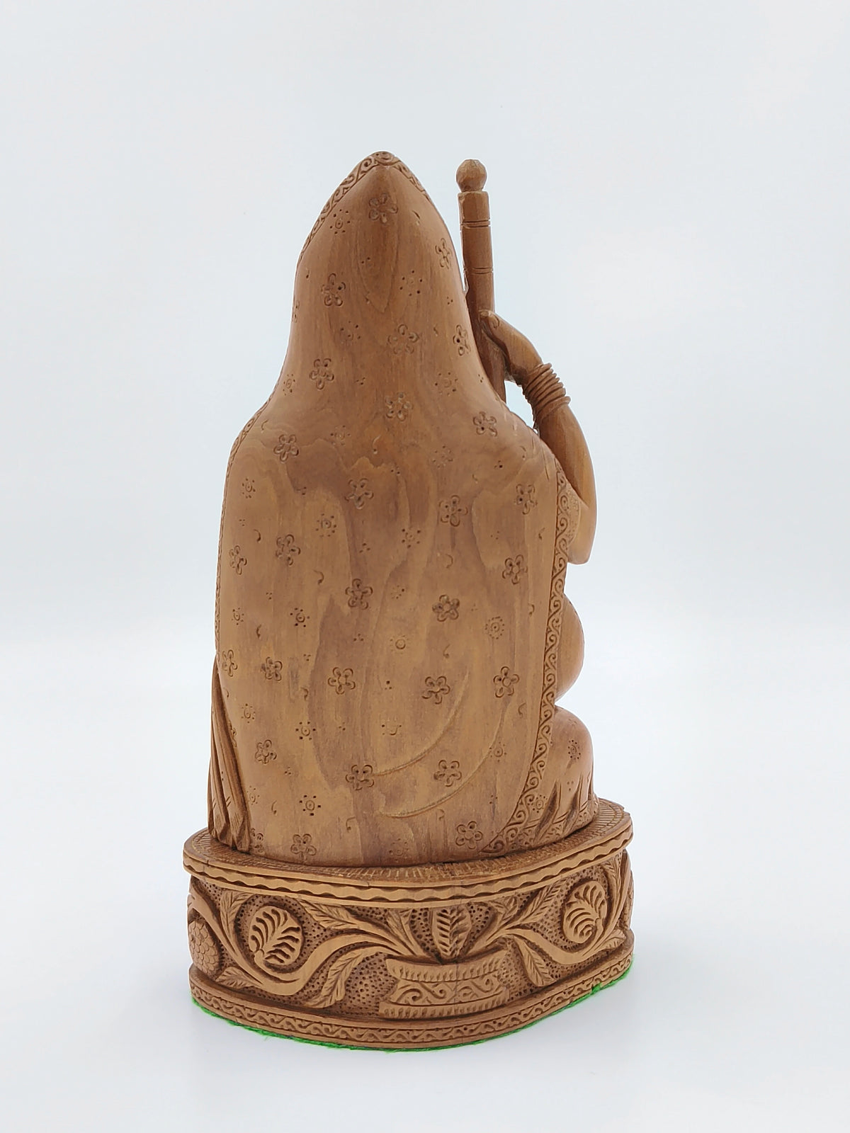 Back view of large sandalwood Meera Bhai idol with intricate floral carvings