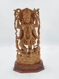 Large sandalwood Kali idol sculpture with multiple arms and detailed carvings on wooden base