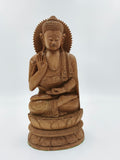 Large sandalwood Buddha sculpture seated in meditation on lotus base