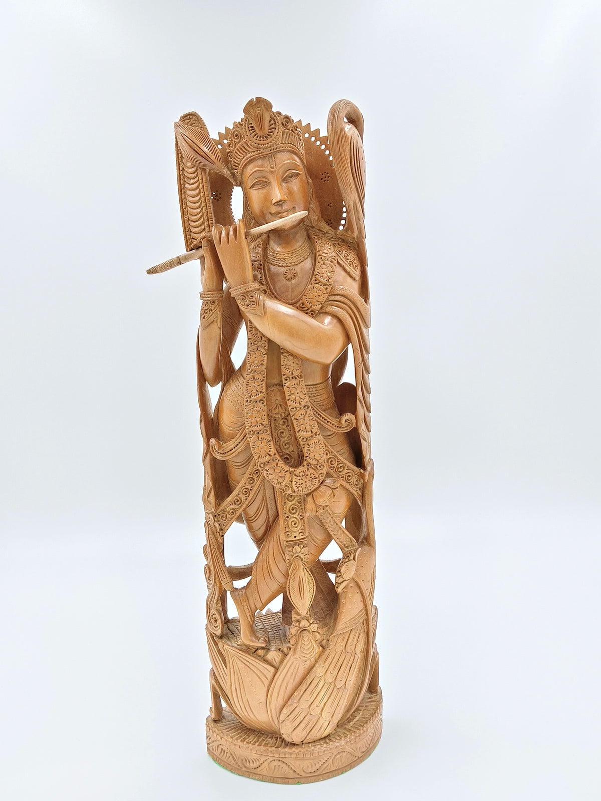 large sandalwood Krishna idol playing flute with intricate carvings