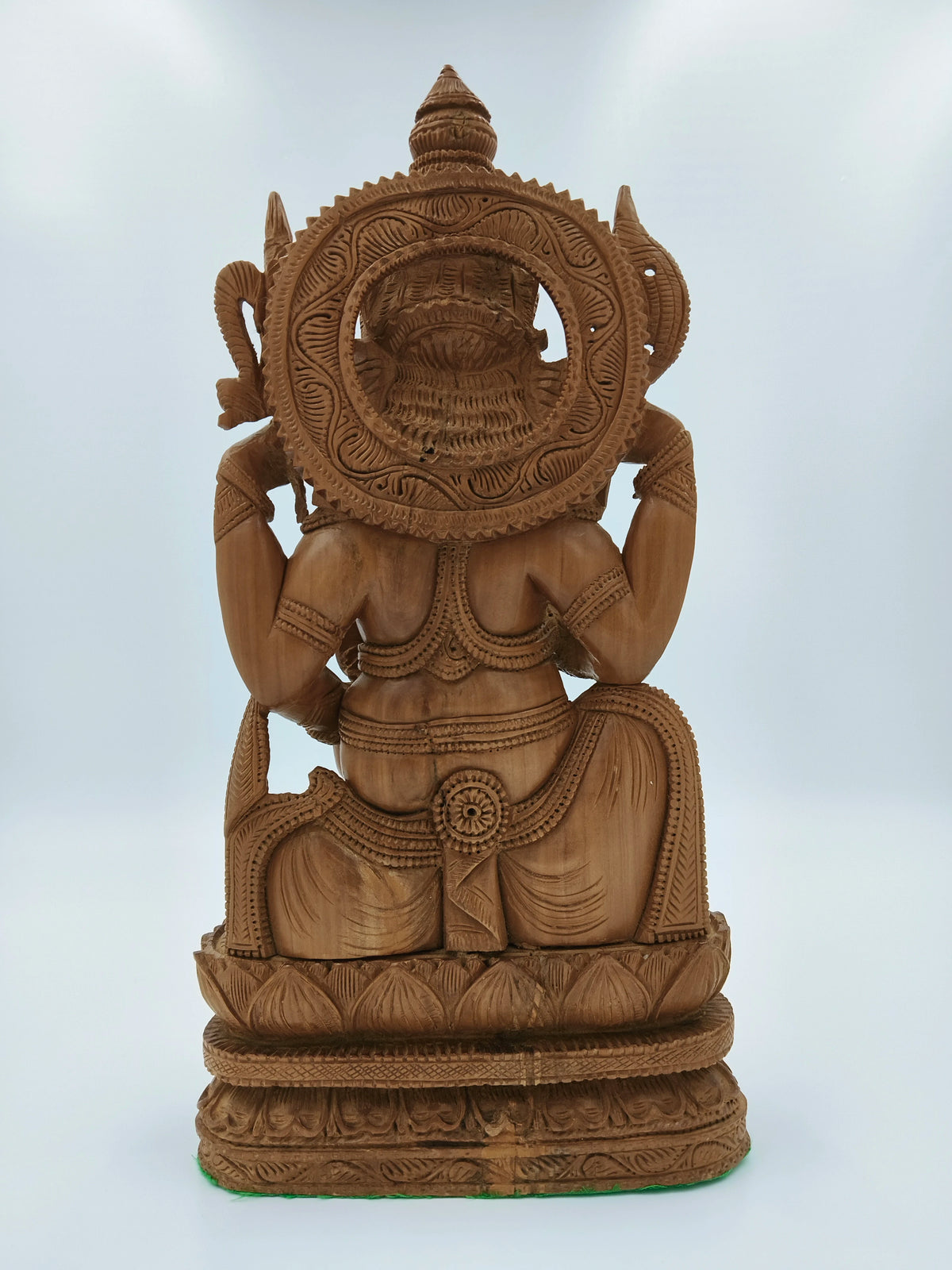 Back view of large sandalwood Ganesh sculpture with intricate carvings