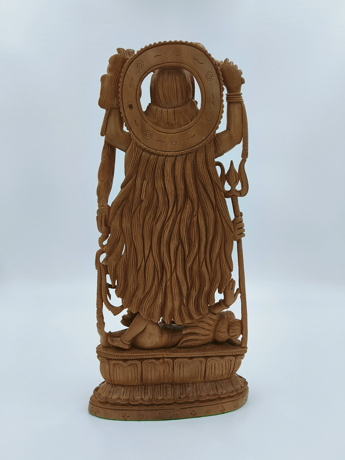 Back view of large sandalwood Kali idol sculpture with detailed carvings