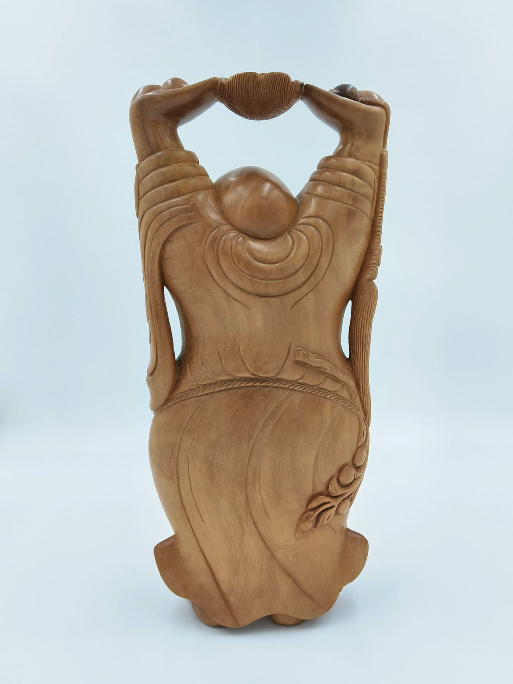 Back view of large sandalwood Laughing Buddha idol with detailed robes and raised arms