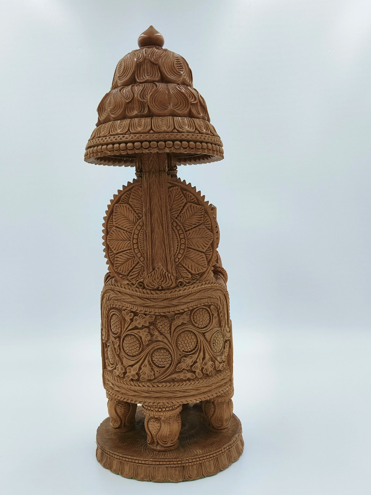 Back view of large sandalwood Ganesh idol with intricate floral carvings