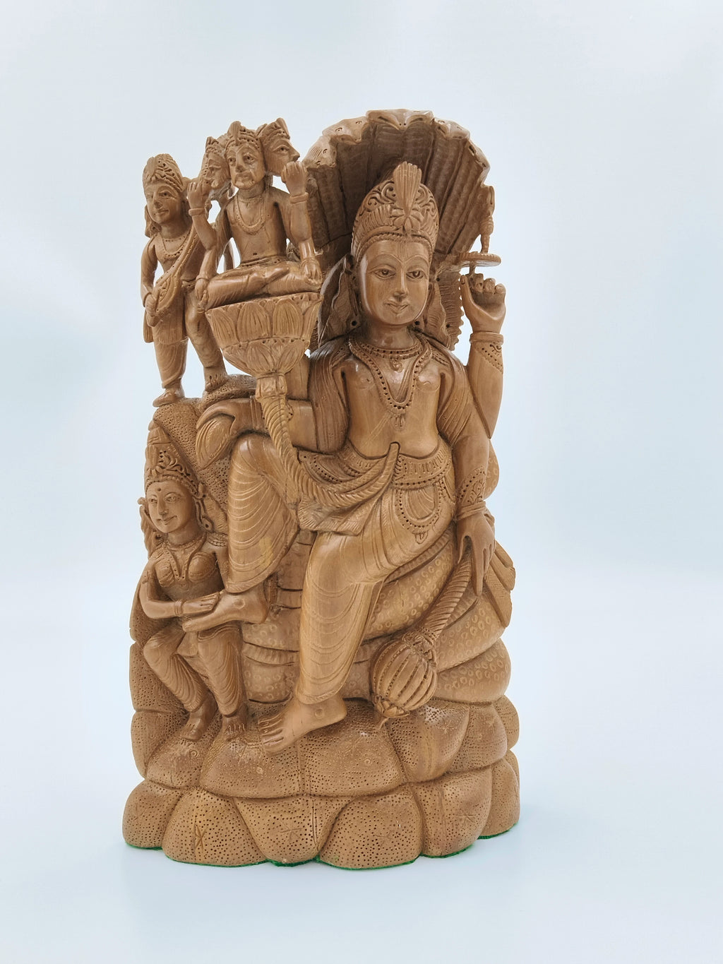 Large sandalwood idol of Vishnu seated on serpent with detailed carvings