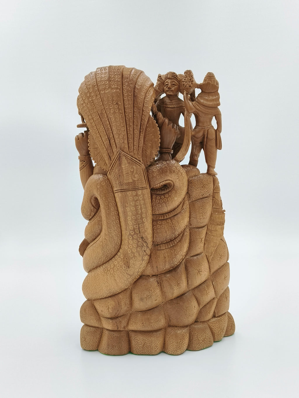 Back view of large sandalwood Vishnu idol with intricate detailing