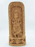 Large sandalwood Ganesh idol playing a flute with intricate carvings