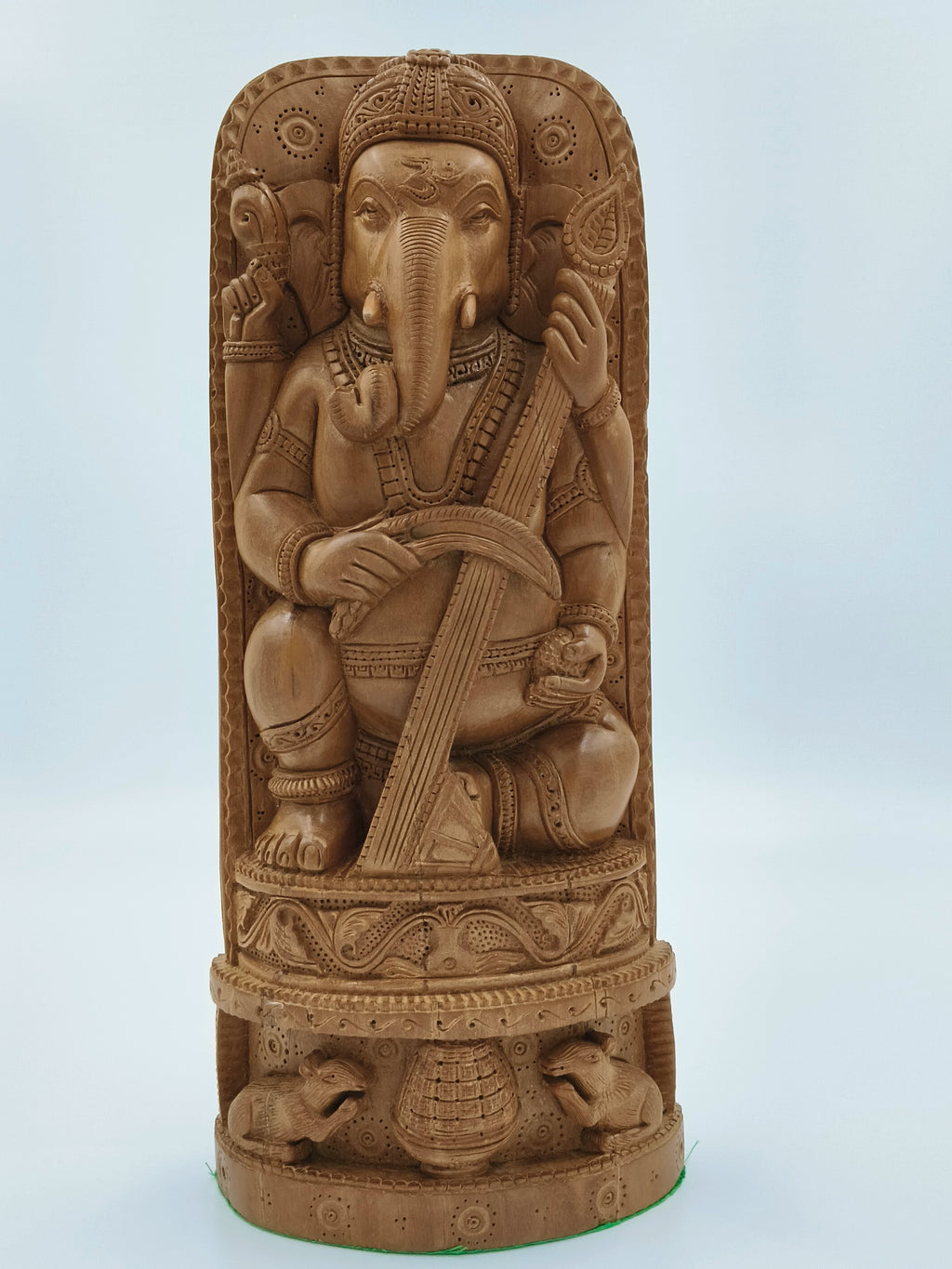 Large sandalwood Ganesh idol seated with musical instrument and carved base